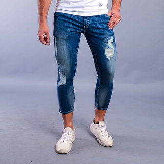 Wrangler Elvis Low Slim Tapered Distress Five Pocket Jeans in Medium Blue Wash