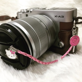 Personalized lens cap holder with charm/s
