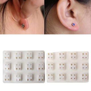 12 pairs gold ear piercing earring set . (1)