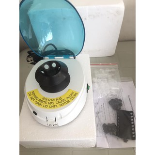 Mini-centrifuge for tubes and strips